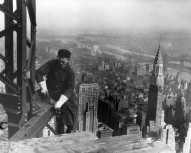 Middle aged iron worker at the Empire State Building construction site, 1930. The Chrysler Building's spire is at right. Photo By Lewis Hine. (63 matches)